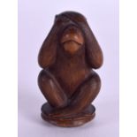 A 19TH CENTURY JAPANESE MEIJI PERIOD CARVED BOXWOOD NETSUKE OKIMONO modelled as a wise monkey