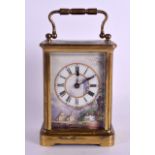 A LATE 19TH CENTURY FRENCH PORCELAIN INSET BRASS CARRIAGE CLOCK painted with classical landscapes.