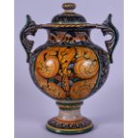 AN ITALIAN MAJOLICA TWIN HANDLED POTTERY VASE AND COVER, decorated with extensive scrolling foliage,