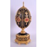 A FRANKLIN MINT FABERGE IMPERIAL JEWELED EGG CHESS SET contained within a jewelled Russian egg. 23