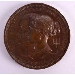 A LARGE 19TH CENTURY BRONZE EXHIBITION MEDAL by W Wyon, depicting a royal portrait. 9.5 cm