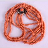 AN EARLY 20TH CENTURY CHINESE RED CORAL NECKLACE with triple strands. 26 grams. Each strand 38 cm