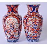 A PAIR OF LATE 19TH CENTURY JAPANESE MEIJI PERIOD IMARI PORCELAIN VASES, painted with panels of