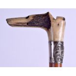 A RARE 19TH CENTURY CARVED DOG HEAD BONE RIDING CROP AND WHISTLE