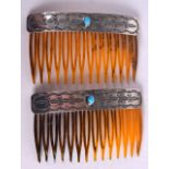 A PAIR OF STERLING SILVER TORTOISESHELL AND TURQUOISE COMBS by Wallace Junior. 8 cm wide.