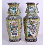 A PAIR OF 19TH CENTURY CHINESE FAMILLE JAUNE PORCELAIN VASES Qing, painted with figures within