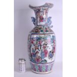 A LARGE 19TH CENTURY CHINESE CANTON FAMILLE ROSE PORCELAIN VASE Qing, painted with figures amongst