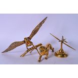 A LARGE EARLY 20TH CENTURY BRASS STATUE OF AN EAGLE, together with a brass aeroplane and a tiger. (