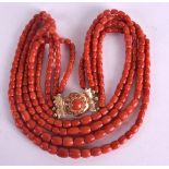 AN 18CT GOLD AND RED CORAL NECKLACE with coral inset clasp. 115 grams. Longest 56 cm long.