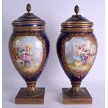 A GOOD LARGE PAIR OF 19TH CENTURY FRENCH SEVRES PORCELAIN VASES AND COVERS painted with figures