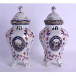 A PAIR OF 19TH CENTURY FRENCH SAMSONS OF PARIS PORCELAIN VASES AND COVERS painted with landscapes.