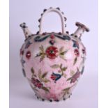 A RARE HUNGARIAN ZSOLNAY PECS BULBOUS PUZZLE TYPE EWER with dual spout, painted with raised foliage.