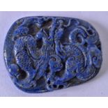 A 20TH CENTURY CHINESE LAPIS LAZULI PENDANT, carved with a dragon amongst the clouds. 5.2 cm x 4.1