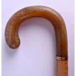 A 19TH CENTURY CARVED RHINOCEROS HORN HANDLED WALKING CANE. 84 cm long, horn 10 cm x 12 cm.