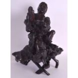 A 19TH CENTURY CHINESE CARVED ROOTWOOD FIGURE OF AN IMMORTAL modelled upon a naturalistic base. 36