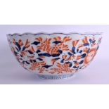 A LARGE 19TH CENTURY JAPANESE MEIJI PERIOD IMARI SCALLOPED BOWL painted with floral sprays. 31 cm