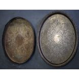 TWO LARGE SILVER PLATED TRAYS, etched with foliage. Largest 55 cm wide.