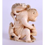 A 19TH CENTURY JAPANESE MEIJI PERIOD CARVED IVORY OKIMONO modelled as a monkey surmounted with