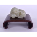 AN EARLY 20TH CENTURY CHINESE CARVED JADE FIGURE OF A BUDDHIST LION modelled clutching a ball. 5.5