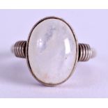 AN EARLY 20TH CENTURY CONTINENTAL SILVER AND OPAL RING. Size P/Q.