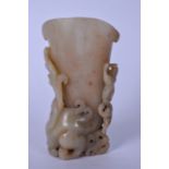 AN EARLY 20TH CENTURY CHINESE HARDSTONE VASE, carved with chilong clinging to the body. 15 cm high.