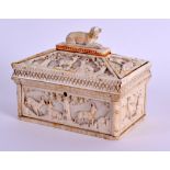 A MID 19TH CENTURY GERMAN CARVED IVORY CASKET AND COVER decorated with animals within landscapes.
