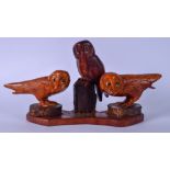 A CARVED WOODEN SCULPTURE OF THREE OWLS, modelled on a naturalistic plinth, "Great Grey Owl, Pair of