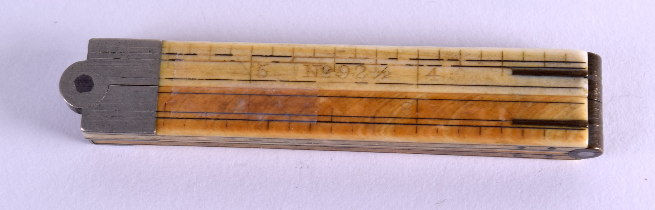 A MID 19TH CENTURY ENGLISH CARVED IVORY FOLDING RULE. 15 cm wide. - Image 3 of 3