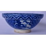 AN EARLY 20TH CENTURY JAPANESE BLUE AND WHITE PORCELAIN BOWL, painted with figures in landscapes,