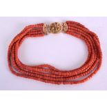 AN 18CT GOLD AND RED CORAL NECKLACE with open work foliate clasp. 130 grams. 45 cm long.