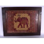 AN EARLY 20TH CENTURY INDIAN EMBROIDERED PANEL, depicting an elephant encased within a geometric