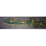 A LARGE 20TH CENTURY CHINESE METAL SWORD, the handle in the form of a dragon. 97 cm long.