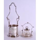 AN EDWARDIAN SILVER PLATED NEO CLASSICAL BOTTLE COASTER together with a plated preserve jar. 35 cm &