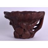 AN EARLY 20TH CENTURY CHINESE CARVED HORN LIBATION CUP of naturalistic form, overlaid with