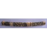 AN EARLY 20TH CENTURY JAPANESE MEIJI PERIOD BONE TANTO, carved with figures in various pursuits.