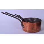 A SET OF FOUR GRADUATED COPPER SAUCEPANS, with thick iron handles. Largest 40 cm total width.