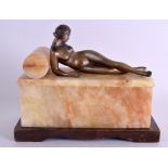 AN ART DECO SPELTER AND ALBASTER BOX AND COVER in the form of a nude female reclining. 23 cm x 19