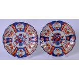 A PAIR OF 19TH CENTURY JAPANESE IMARI PORCELAIN LOBED DISHES, painted with panels of foliage. 21