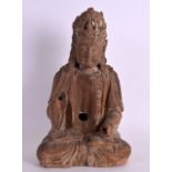 A CHINESE YUAN/MING DYNASTY CARVED WOOD FIGURE OF A SEATED BUDDHA elegantly modelled with an arm