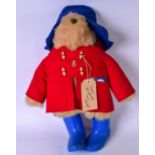 A VINTAGE PADDINGTON BEAR STUFFED TOY, modelled in red coat and blue boots. 52 cm.