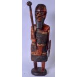 A LARGE AFRICAN TRIBAL CARVED WOODEN FIGURE, in the form of a warrior or elder, standing holding a