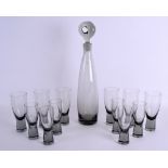 A 1960's SCANDANAVIAN ARISTOCRAT DECANTER AND GLASSES designed by Per Lutkin. Decanter 38 cm