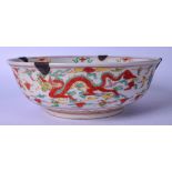 A LARGE CHINESE WUCAI PORCELAIN BOWL BEARING XUANDE MARKS, painted with dragons and panels of