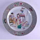 A CHINESE FAMILLE ROSE PORCELAIN PLATE 20th Century, painted with four figures within an interior.