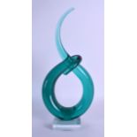 A STYLISH STYLISED GREEN GLASS SCULPTURE upon a clear glass base. 34 cm x 14 cm.