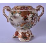 AN EARLY 20TH CENTURY JAPANESE SATSUMA TWIN HANDLED POTTERY VASE, painted with extensive foliage,