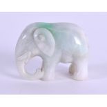 AN EARLY 20TH CEN TURY CHINESE CARVED JADEITE FIGURE OF AN ELEPHANT modelled in a roaming stance.