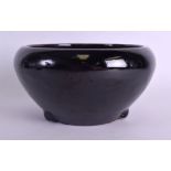 A 19TH CENTURY CHINESE BLACK GLAZED STONEWARE CENSER with drip glazed decoration to the bowl. 22