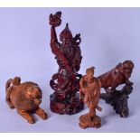 AN EARLY 20TH CENTURY CHINESE CARVED HARDWOOD FIGURE OF A WARRIOR, together with a tiger, lion and
