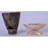 AN EARLY CARVED HARDSTONE BEAKER, engraved with foliage, together with a mother of pearl pedestal